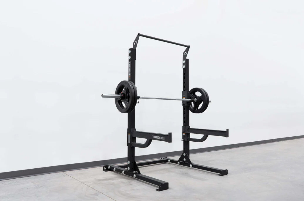 short squat rack with bar and plates and spotter arms